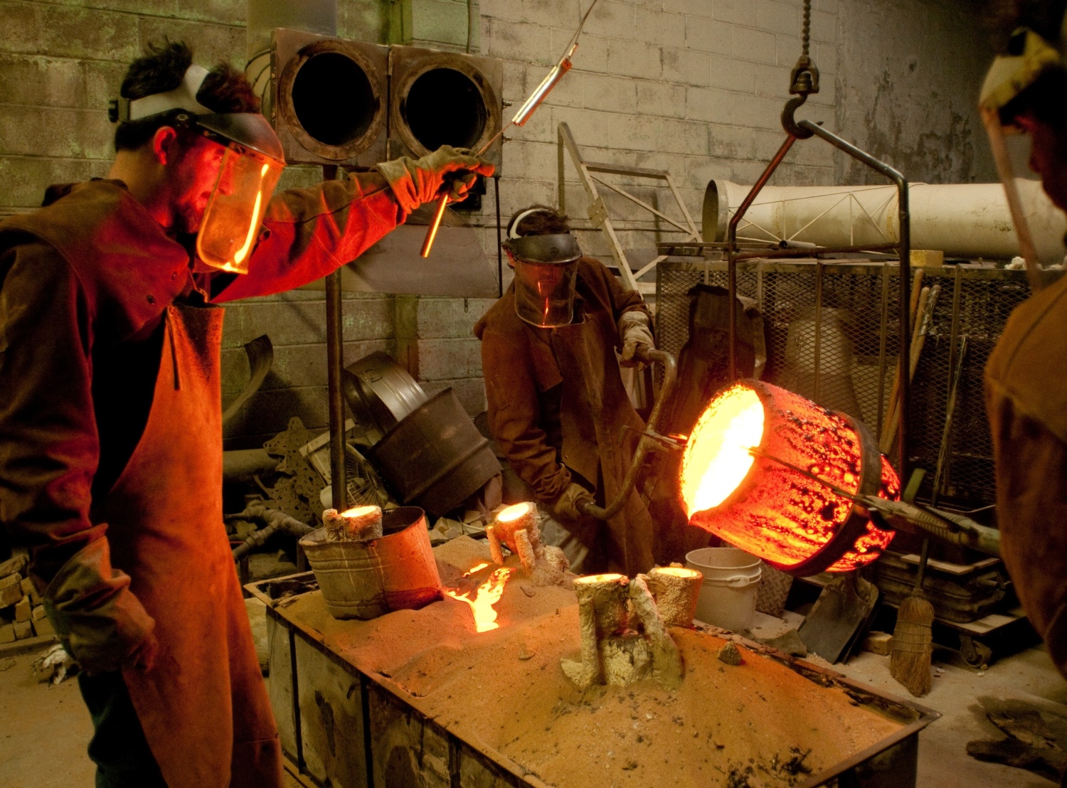 Pouring the molten bronze into ceramic shells
