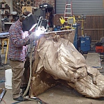 Welding the sections of the statue together
